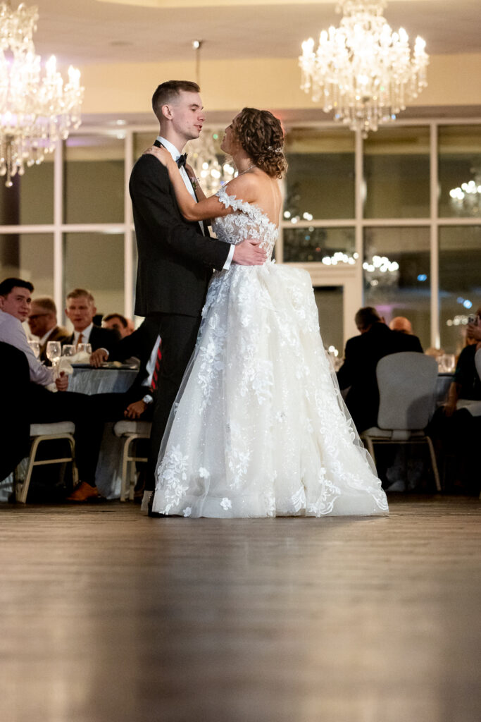 A couple shares their first dance at an elegant wedding reception at Ashton Gardens in atlanta