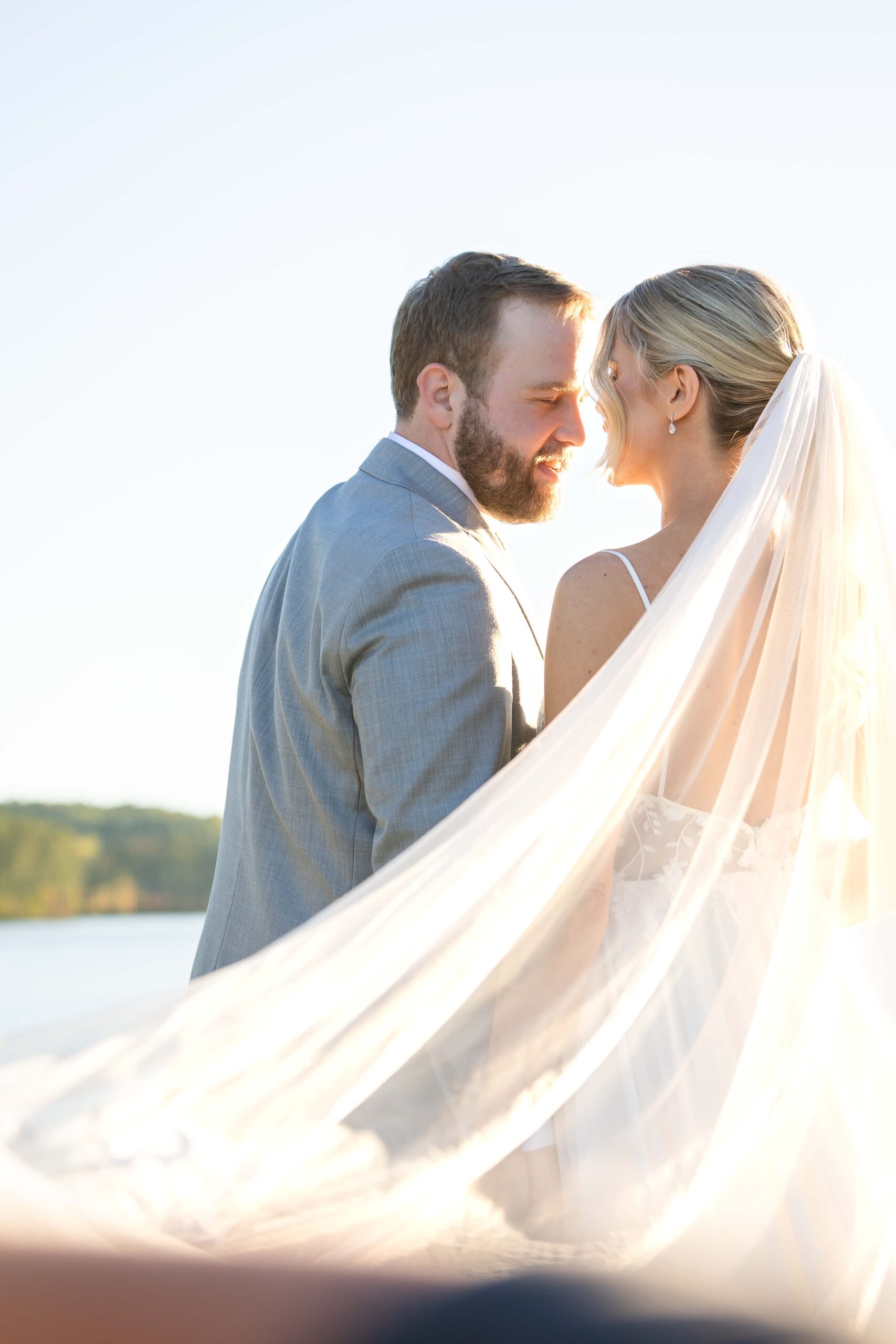 Bride and groom share an intimate moment during golden hour