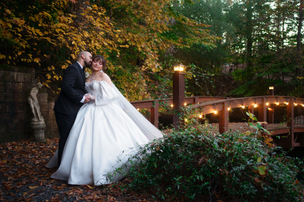 Bridal portraits on a bridge at Rocky's Lake Estate