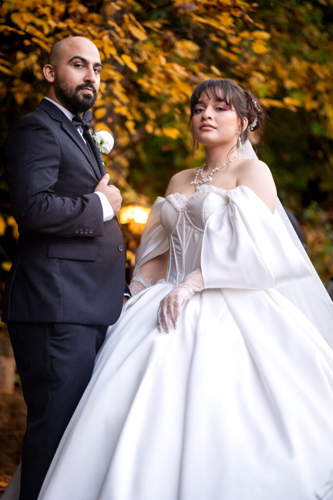bride and groom pose during their wedding portraits at rockys' lake estate