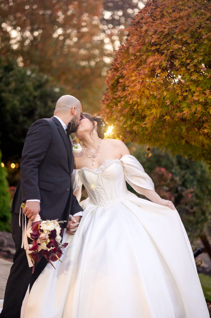 bride and groom kiss at their wedding at rocky's lake esate