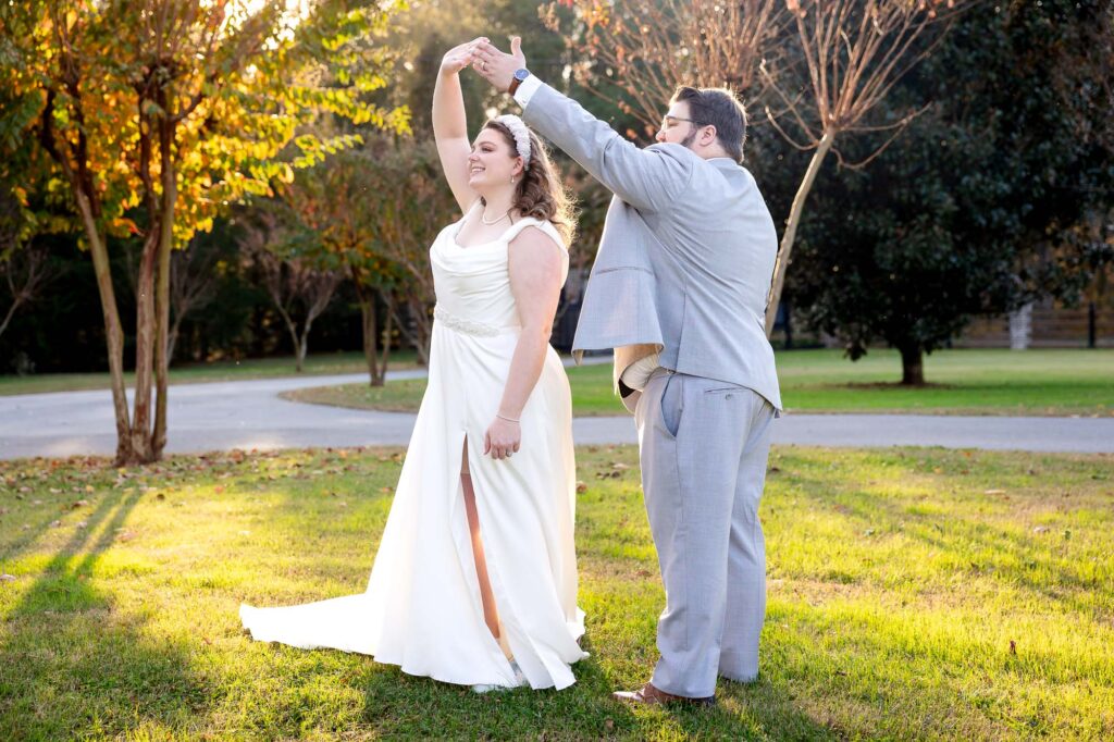 bride and groom shares a candid moment dancing 