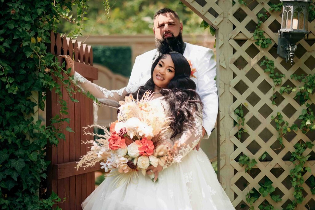bride and groom poses during their wedding at Castle at Wildwood gardens