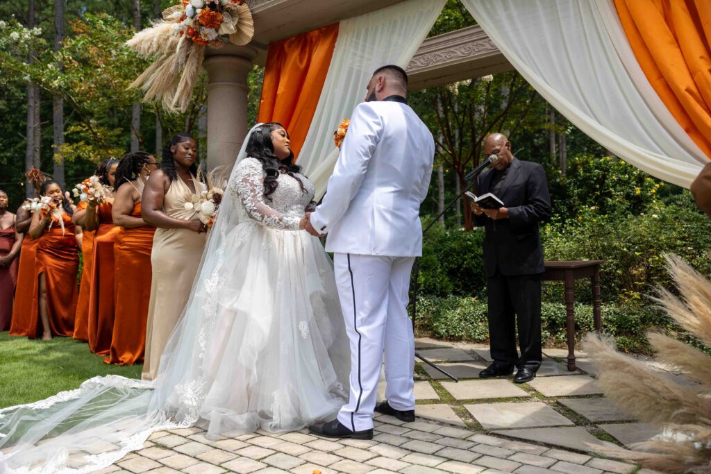 A beautiful outdoor garden wedding ceremony at The castle at wildwood gardens