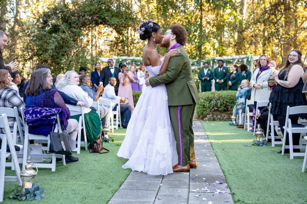 bride and groom sharing a kiss during their ceremony