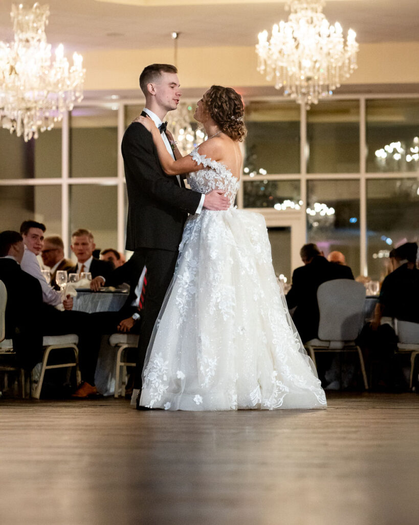bride and groom dance during their reception at ashton gardens 