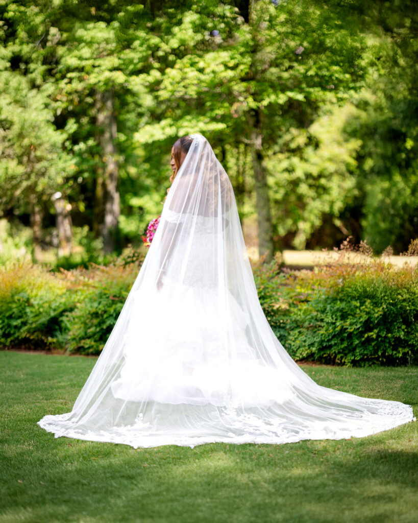 bride posing in a garden at Pristine Chapel 