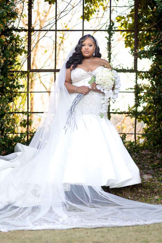 Elegant bride posing in gown at Bibb Mill Event Center, natural true-to-color photography