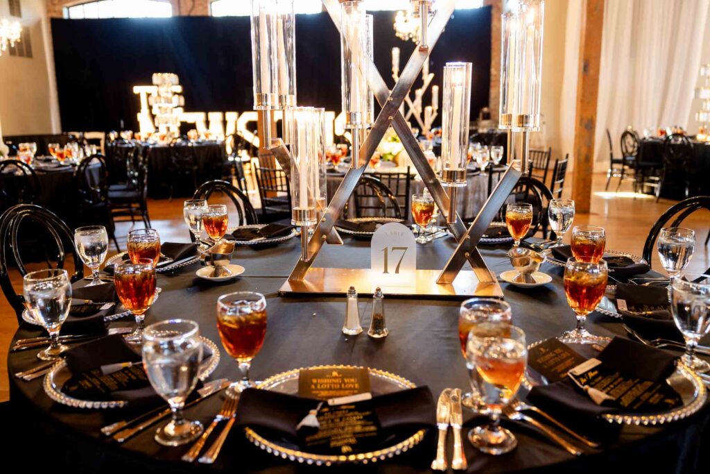 Bibb Mill Event Center wedding reception tables with elegant floral arrangements, captured in true-to-color photography