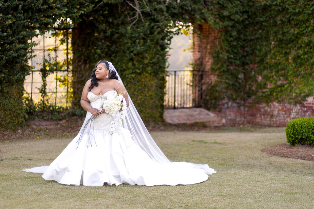 bride posing for her photos at bibb mill event center
