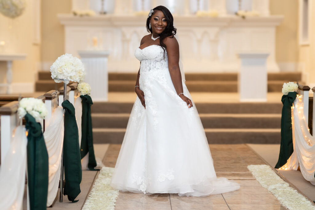 bride poses inside pristine chapel