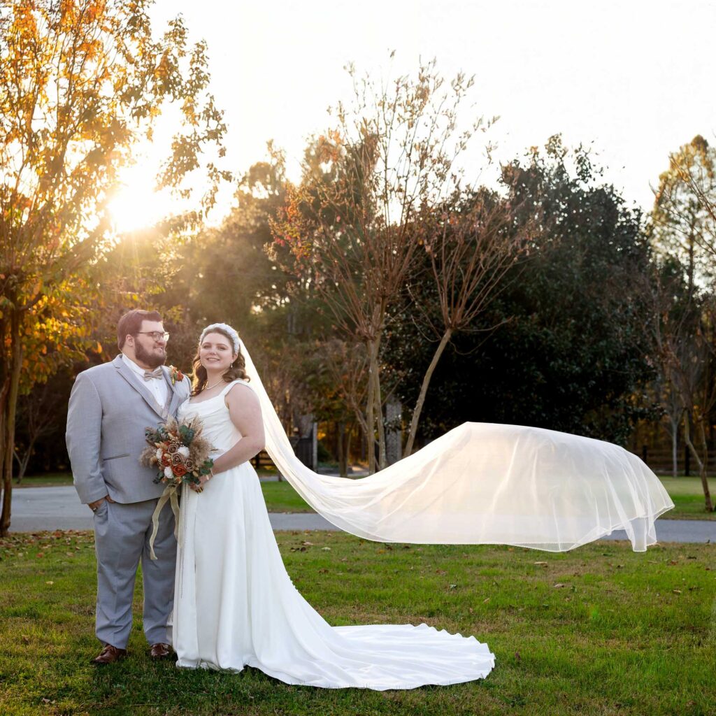 bride & groom with flowing veil photo at beautiful-beginnings-farm