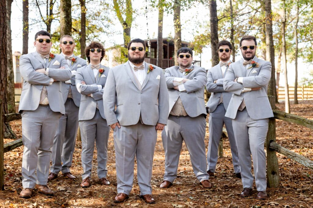 groom and his groomsmen posing 