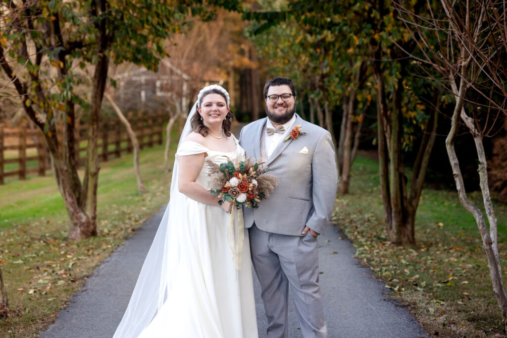 wedding couple poses during their wedding at beautiful beginnings farm 