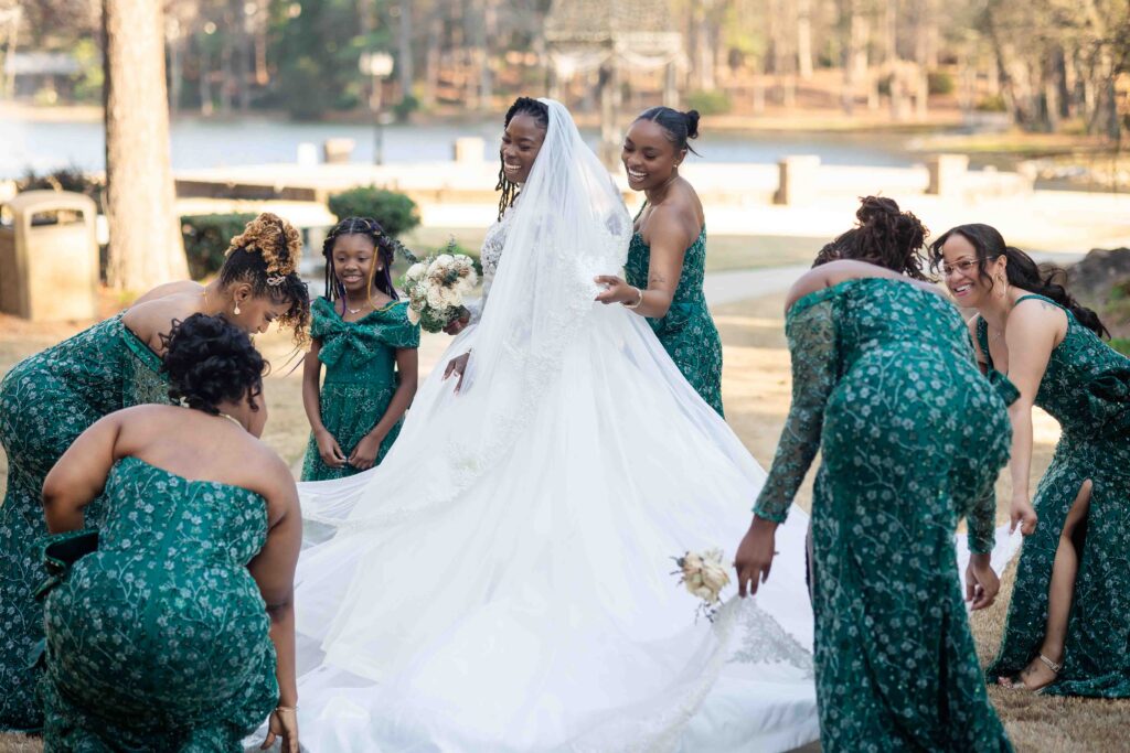 bride and bridesmaid sharing a candid moment the wedding at Pristine chapel in Atlanta 