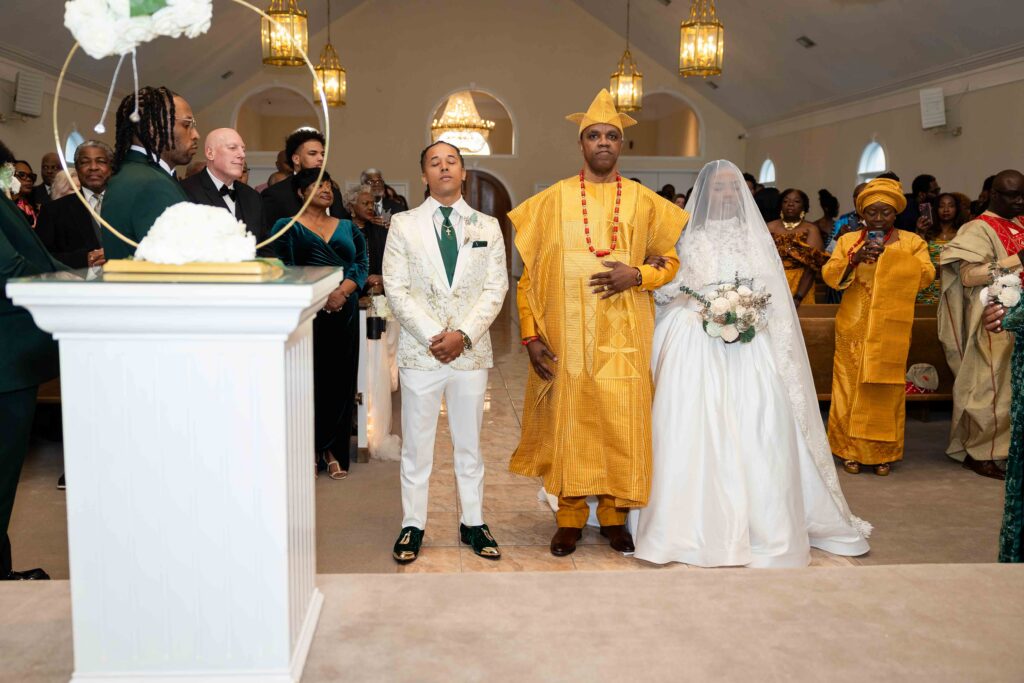 father dressed in african at the alter with his daughter at a wedding at Pristine chapel in Atlanta 