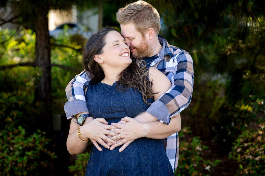 Couple embracing in urban Decatur Georgia engagement photography session